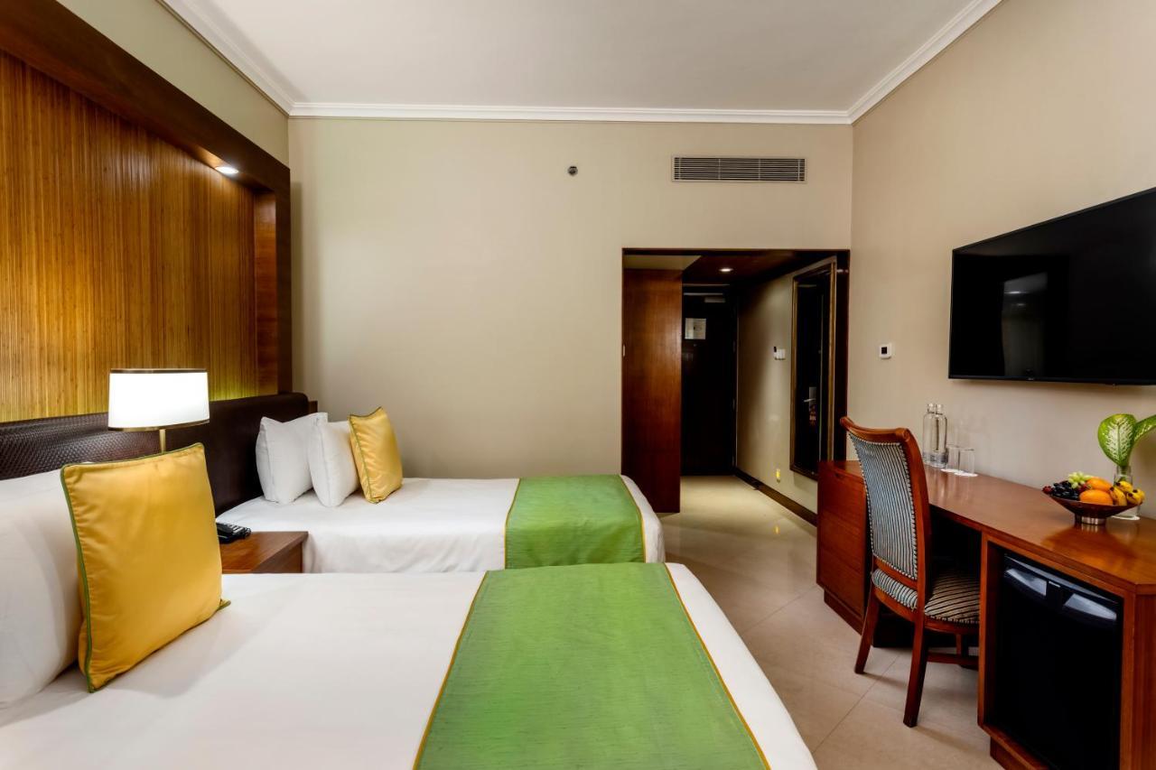 Caravela Beach Resort Varca Kültér fotó A room at the hotel