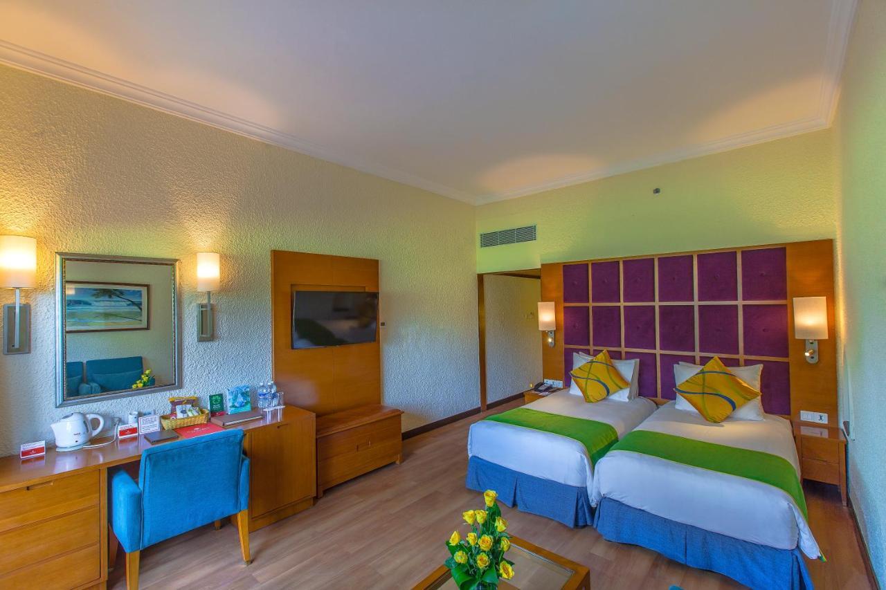 Caravela Beach Resort Varca Kültér fotó A room at the hotel